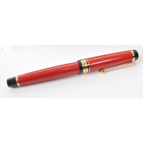 383 - Pilot - A contemporary Pilot Custom 845 Urushi fountain pen. The pen having red Urushi lacquered bod... 