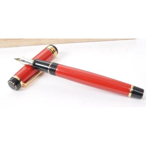 383 - Pilot - A contemporary Pilot Custom 845 Urushi fountain pen. The pen having red Urushi lacquered bod... 