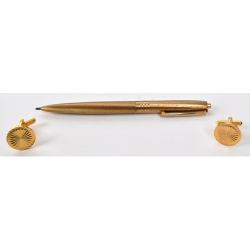 384 - A vintage 20th century London Executive 22ct gold plated pen and cufflink set. The pen having brushe... 