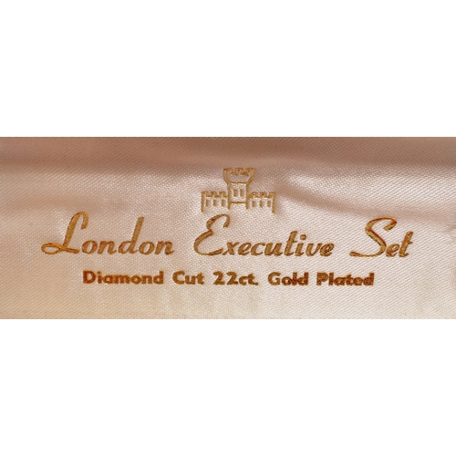 384 - A vintage 20th century London Executive 22ct gold plated pen and cufflink set. The pen having brushe... 