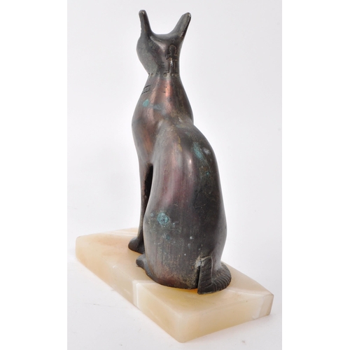 386 - A vintage 20th-century bronze statue of an Egyptian cat, screwed and raised onto a stone base. Measu... 