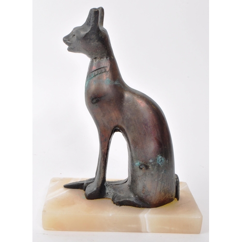 386 - A vintage 20th-century bronze statue of an Egyptian cat, screwed and raised onto a stone base. Measu... 