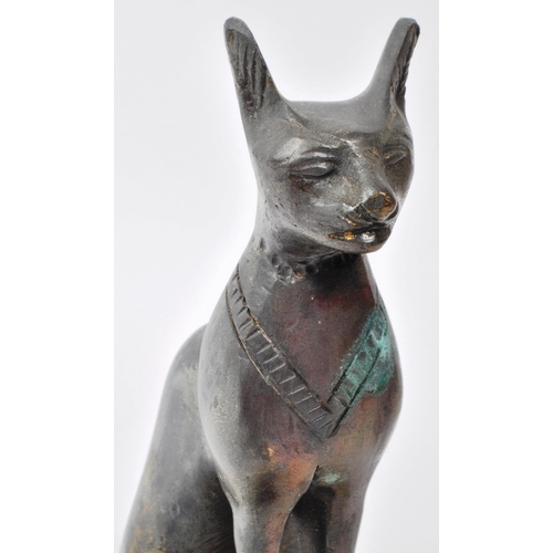 386 - A vintage 20th-century bronze statue of an Egyptian cat, screwed and raised onto a stone base. Measu... 