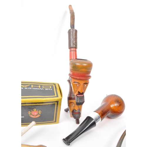 387 - A large collection of 20th century tobacco pipes. The collection featuring briar, wooden, ceramic, a... 