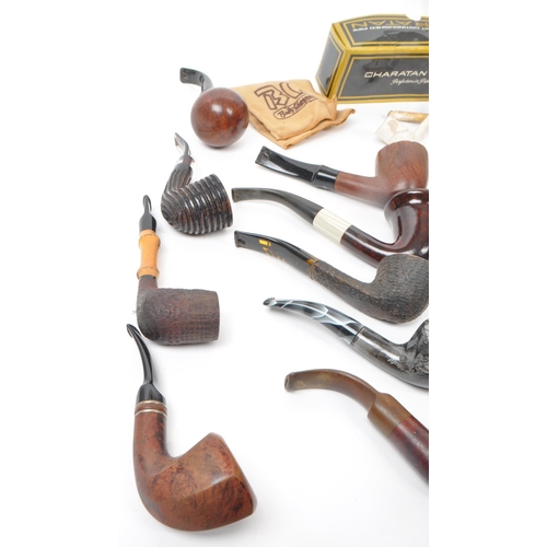 387 - A large collection of 20th century tobacco pipes. The collection featuring briar, wooden, ceramic, a... 