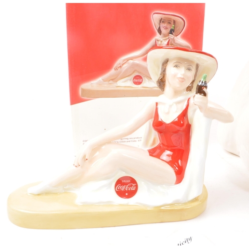 401 - Coca-Cola - A collection of vintage Coca Cola ceramic figures. The collection to include two limited... 