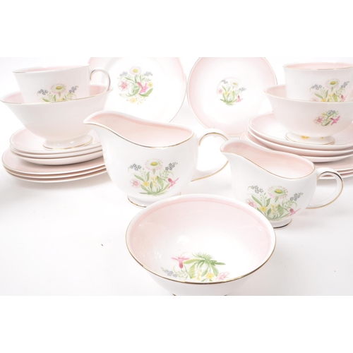 403 - Susie Cooper - A collection of mid-century bone china tea service pieces, in 'Romance' pink. Featuri... 