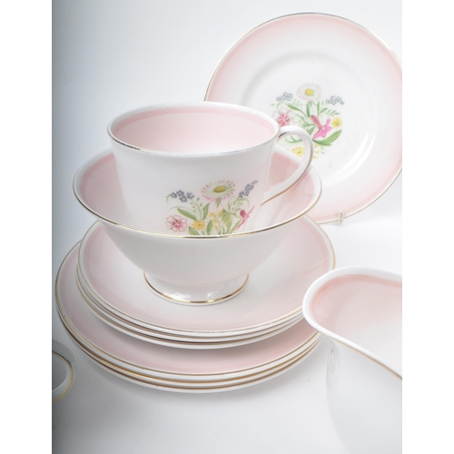 403 - Susie Cooper - A collection of mid-century bone china tea service pieces, in 'Romance' pink. Featuri... 