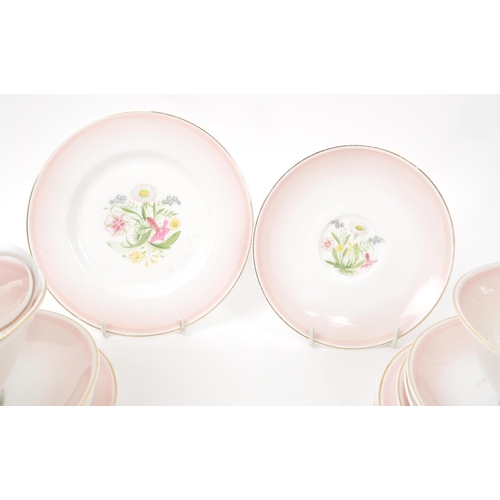 403 - Susie Cooper - A collection of mid-century bone china tea service pieces, in 'Romance' pink. Featuri... 