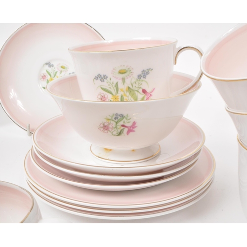 403 - Susie Cooper - A collection of mid-century bone china tea service pieces, in 'Romance' pink. Featuri... 