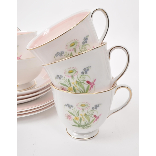 403 - Susie Cooper - A collection of mid-century bone china tea service pieces, in 'Romance' pink. Featuri... 