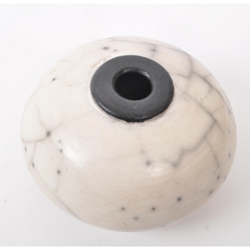 408 - Susie Curtis - A contemporary Australian studio pottery squat pot / vase. Featuring a white, black a... 