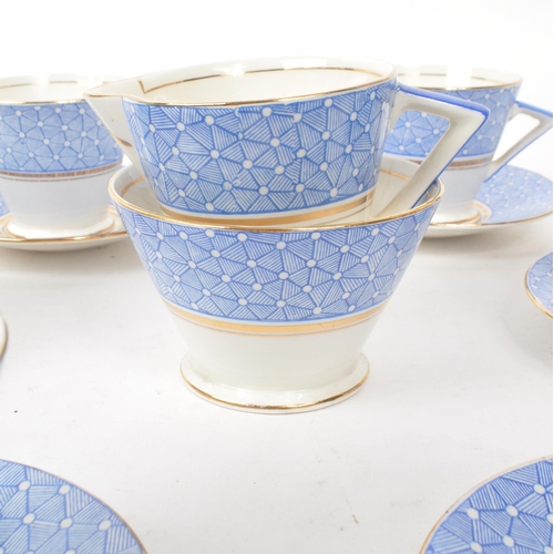 411 - A collection of vintage early 20th-century art deco porcelain tea service pieces, in the style of Sh... 