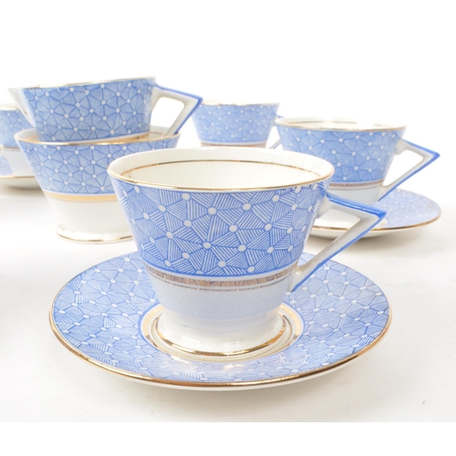 411 - A collection of vintage early 20th-century art deco porcelain tea service pieces, in the style of Sh... 