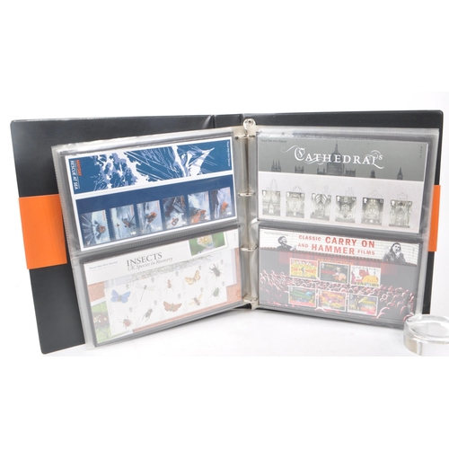 420 - A collection of 21st-century British Royal Mail stamp presentation packs. The collection includes ex... 