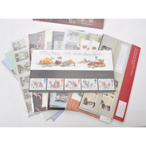 423 - A collection of 21st-century British Royal Mail stamp presentation packs. The collection includes ex... 