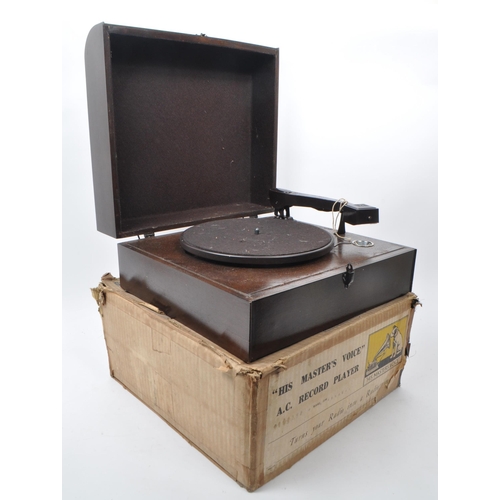 433 - Columbia - HMV - An early 20th-century A.C. record player, model 2100. With a wooden case and bakeli... 