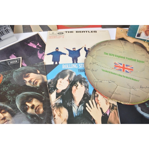 443 - A collection of thirteen vintage 20th century vinyl records, featuring artists such as The Beatles, ... 