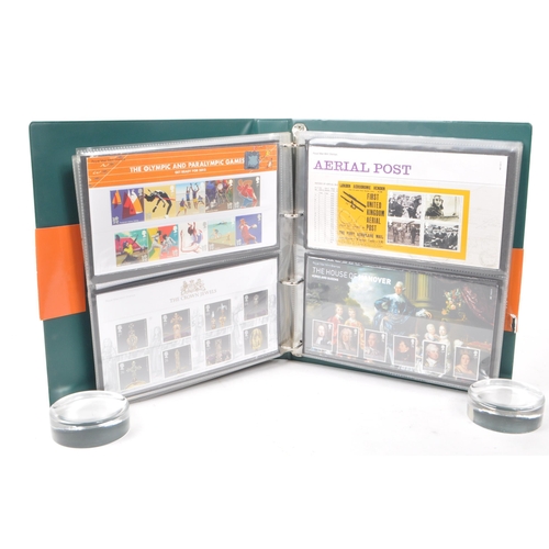 453 - A collection of 21st-century British Royal Mail stamp presentation packs. The collection includes ex... 