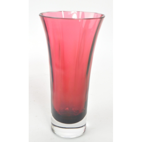 46 - A collection of four 20th century pink glass vases, comprising of a Caithness Scotland purple '40' a... 