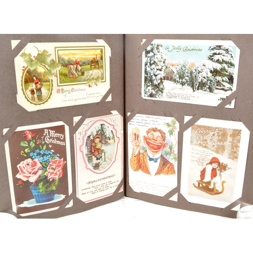 470 - Christmas greetings themed poscards early to mid 20th century. Collection of 348 in a Victorian albu... 