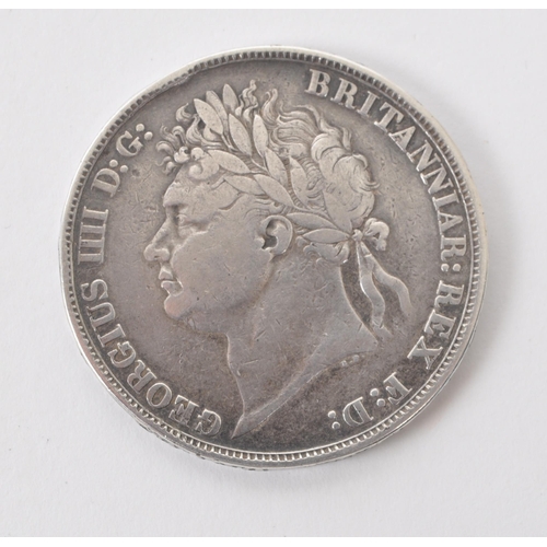 484 - An early 19th century 1821 George IV silver crown coin. Having George IV 1st portrait bust to obvers... 