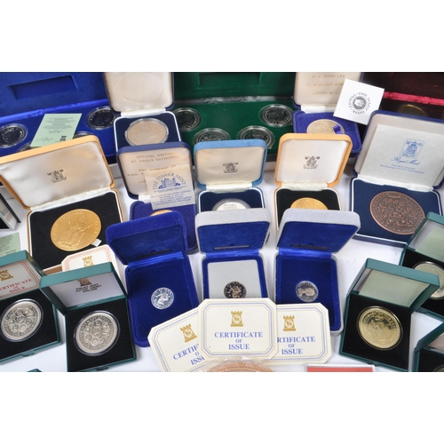 487 - A large collection of 20th century British and Crown Dependencies proof coins and medals. The collec... 