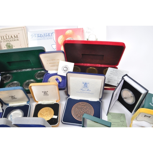 487 - A large collection of 20th century British and Crown Dependencies proof coins and medals. The collec... 