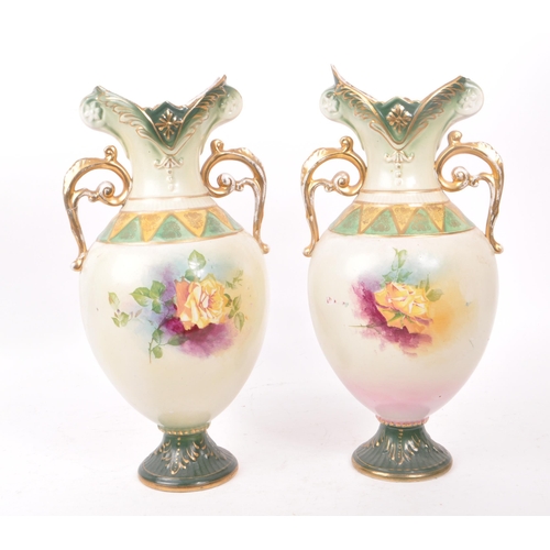 49 - Two mid 19th century Royal Worcester vases, trophy shaped and numbered 195 to the bases. Featuring h... 