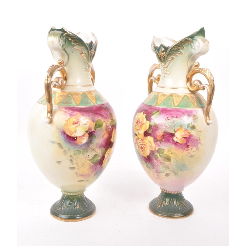 49 - Two mid 19th century Royal Worcester vases, trophy shaped and numbered 195 to the bases. Featuring h... 