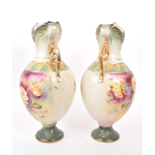 49 - Two mid 19th century Royal Worcester vases, trophy shaped and numbered 195 to the bases. Featuring h... 