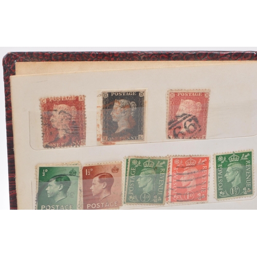 509 - A small album of 19th and 20th century British postage stamps. The collection to include a early red... 