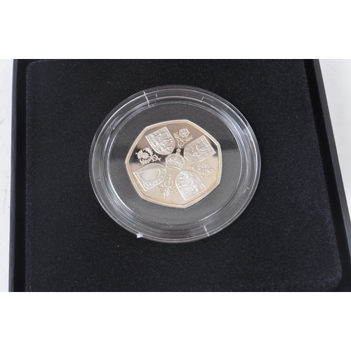 526 - Royal Mint - A collection of three 21st century commemorative silver proof 50p coins. The collection... 