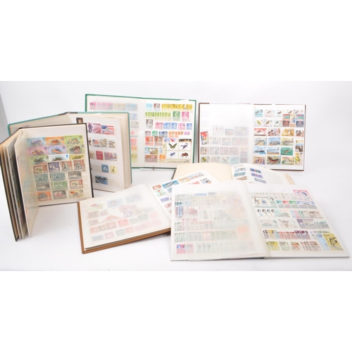 529 - A collection of 20th century British and Foreign postage stamps. The collection across seven small s... 