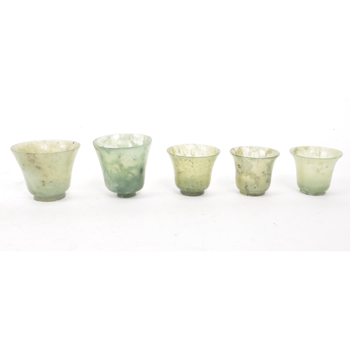 53 - Five early 20th century Chinese hardstone cups, slightly varying in sizes. In a light green colour, ... 