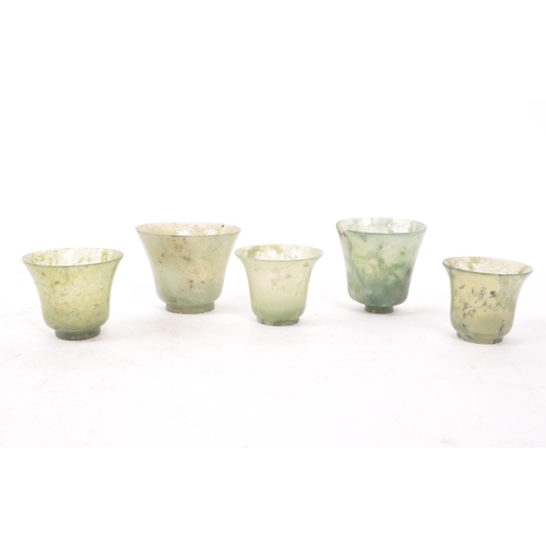 53 - Five early 20th century Chinese hardstone cups, slightly varying in sizes. In a light green colour, ... 