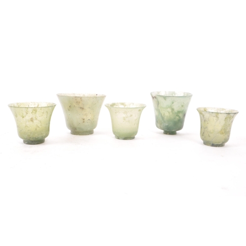 53 - Five early 20th century Chinese hardstone cups, slightly varying in sizes. In a light green colour, ... 