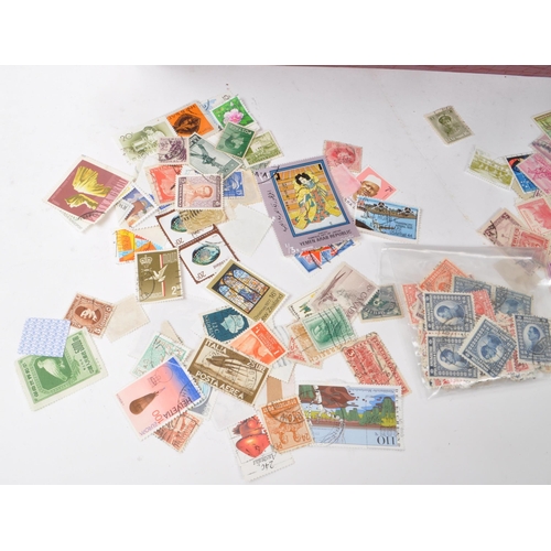 537 - A collection of 20th century British and Foreign kiloware loose postage stamps. The collection featu... 