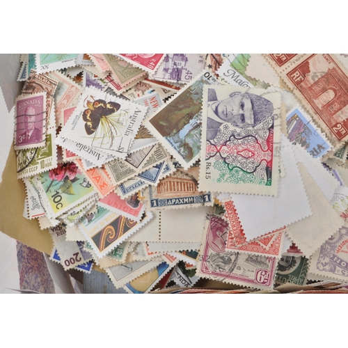 541 - A collection of 20th century British and Foreign kiloware loose postage stamps. The collection featu... 