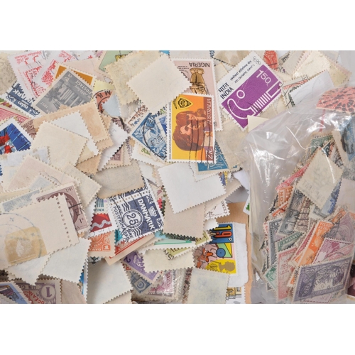 541 - A collection of 20th century British and Foreign kiloware loose postage stamps. The collection featu... 