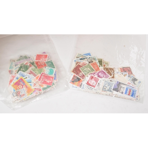 543 - A collection of 20th century British and Foreign kiloware loose postage stamps. The collection featu... 