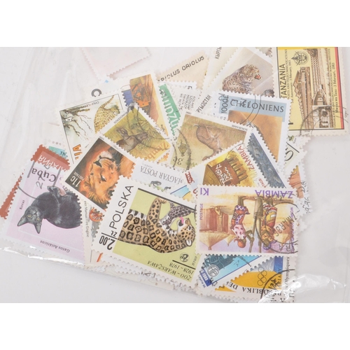 543 - A collection of 20th century British and Foreign kiloware loose postage stamps. The collection featu... 