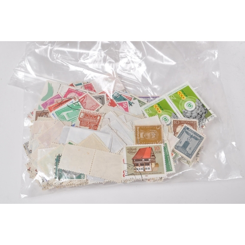 544 - A collection of 20th century British and Foreign kiloware loose postage stamps. The collection featu... 