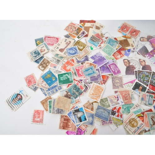 546 - A collection of British and Foreign kiloware postage stamps. The collection to include examples from... 