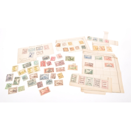 549 - A collection of 19th and early 20th century Iranian, Iraqi, Turkiye, and Indian postage stamps. The ... 