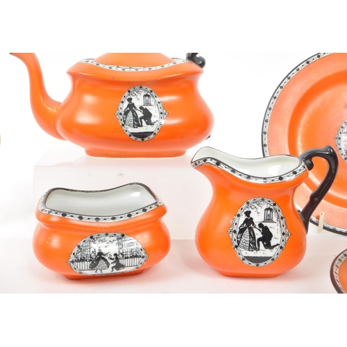 58 - Carlton Ware - A collection of early 20th-century porcelain tea service pieces, including a teapot, ... 