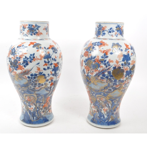 59 - A pair of tall 19th century Chinese glazed vases (1 AF). Traditional blue and red flora and fauna de... 