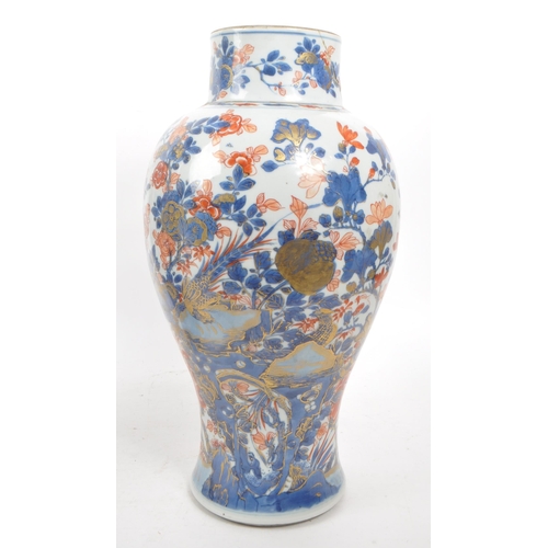 59 - A pair of tall 19th century Chinese glazed vases (1 AF). Traditional blue and red flora and fauna de... 