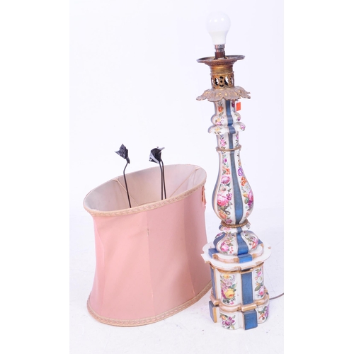 60 - A tall porcelain table lamp with ornate metal head and pale pink lampshade. The porcelain body is de... 