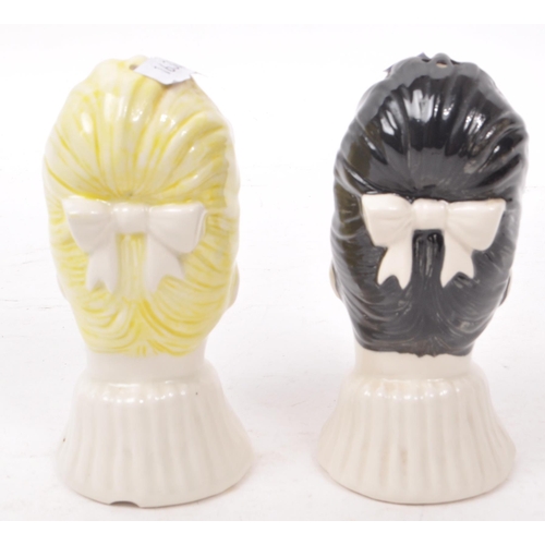 62 - Swineside - Two late 20th century kitsch style ceramic salt and pepper shakers, in the form of two w... 